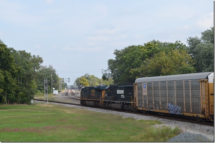 N/b empty multi-level train behind CSX 877-NS 2567 heads up the CE&D.